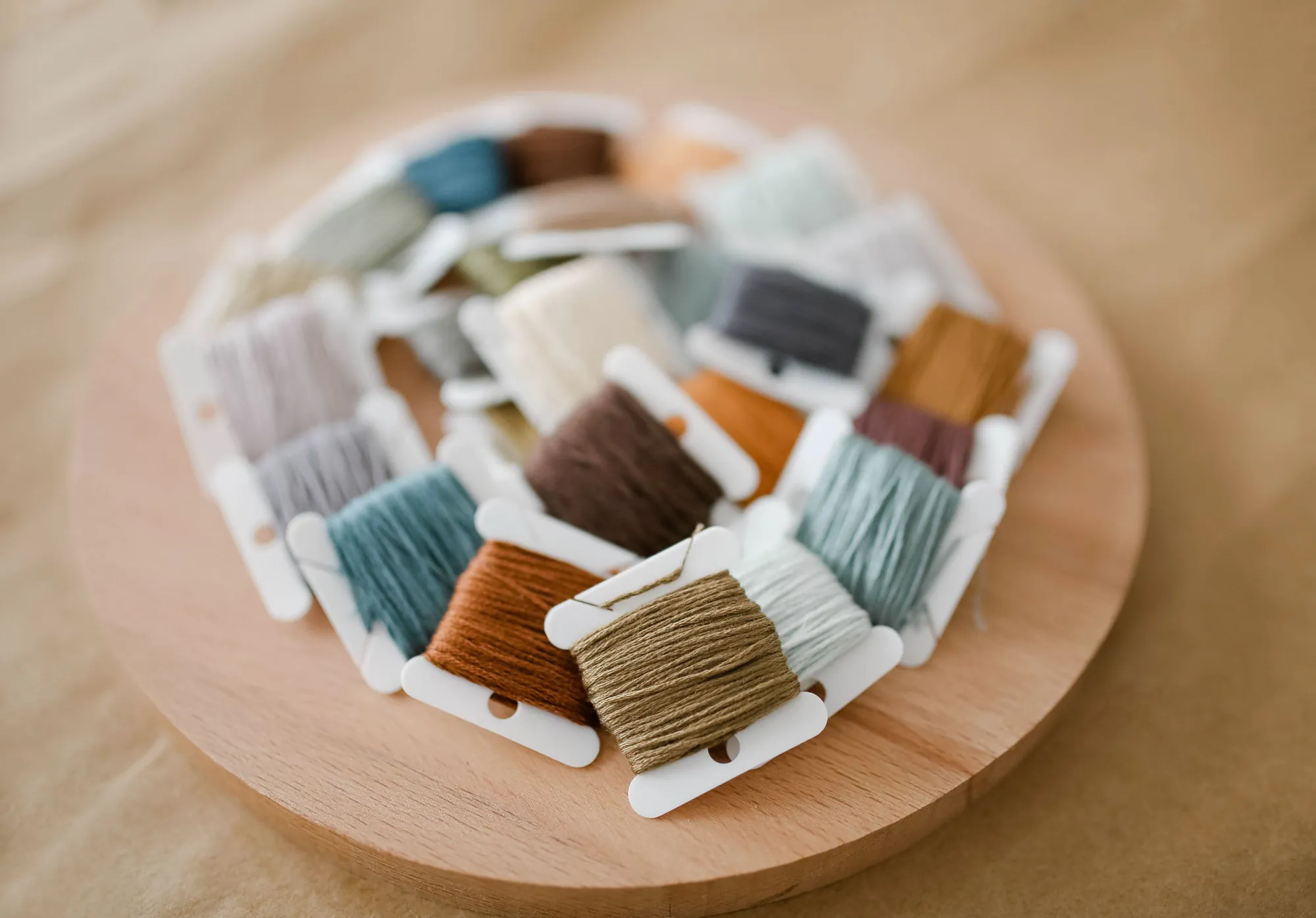 Floss wound on cards: brands match closely, never exactly