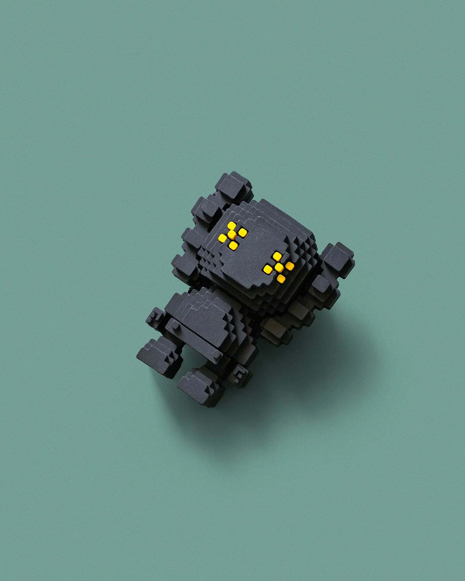 A pixel art robot, built one square at a time